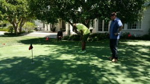 Putting on Private Backyard Practice Putting Green in Artificial Grass