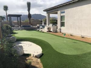 artificial grass golf green in side yard