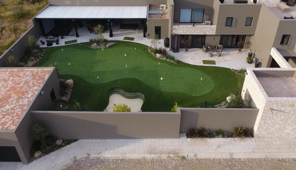 overhead view of synthetic grass backyard putting green