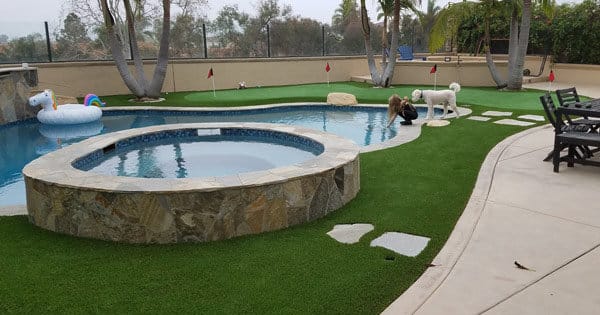 residential artificial grass around backyard pool
