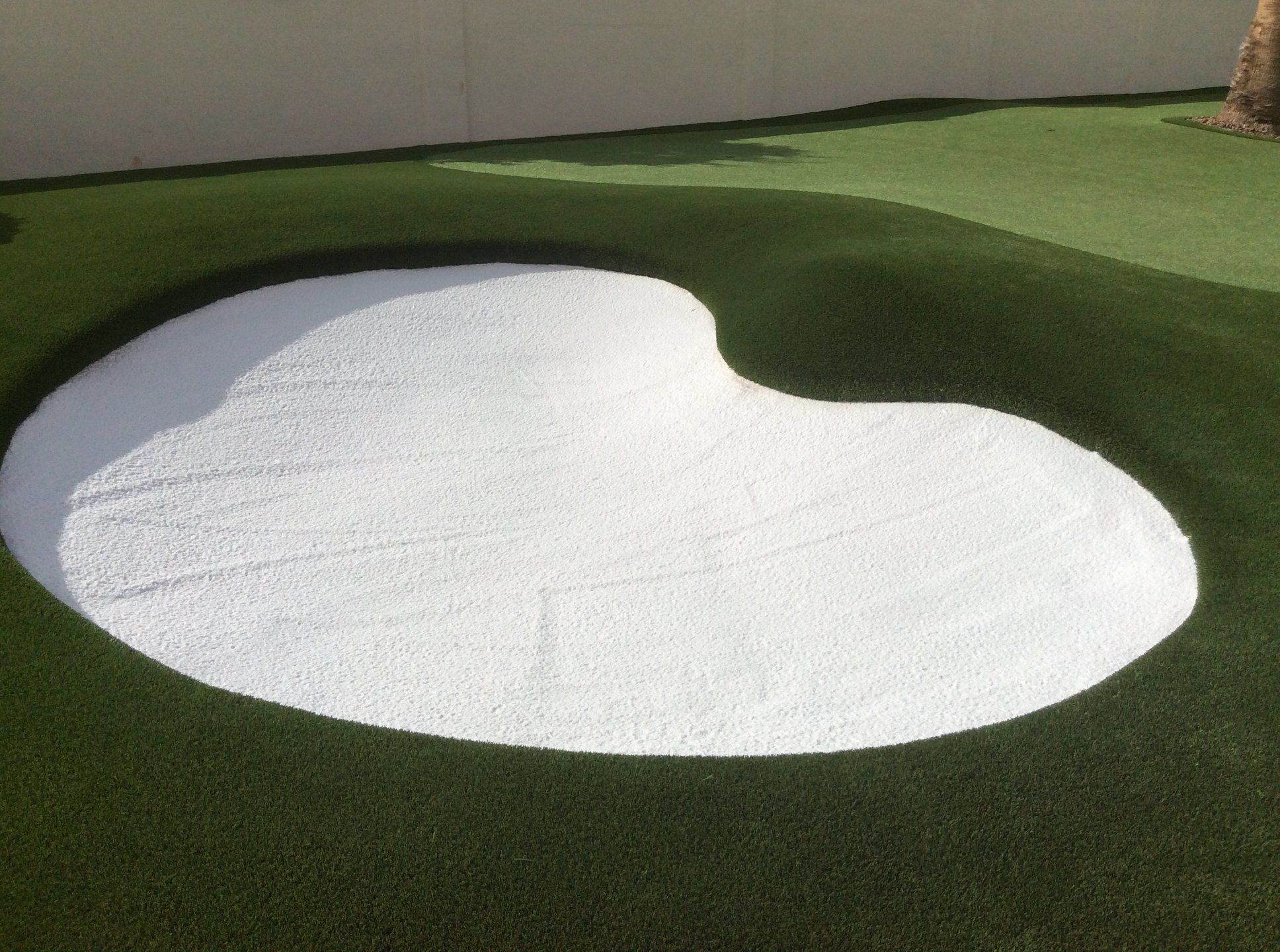 artificial grass backyard putting green with white sand bunker