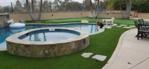 Private Backyard Putting Green in artificial grass around pool