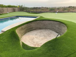 private golf green with stacked sod bunker