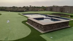 private golf green surrounding pool